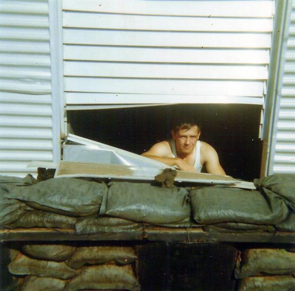 Randy Richmond Looking Through A Hole In His Hootch Where A Piece Of The Roof Went Through 
